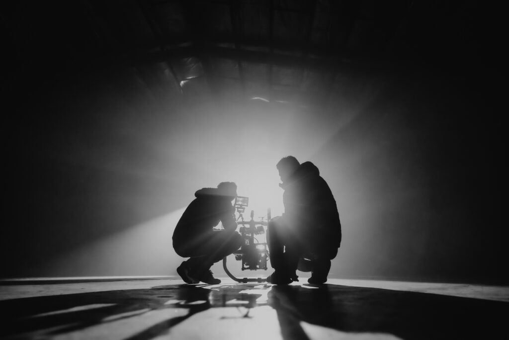 Director and Producer line up camera shot before action is called